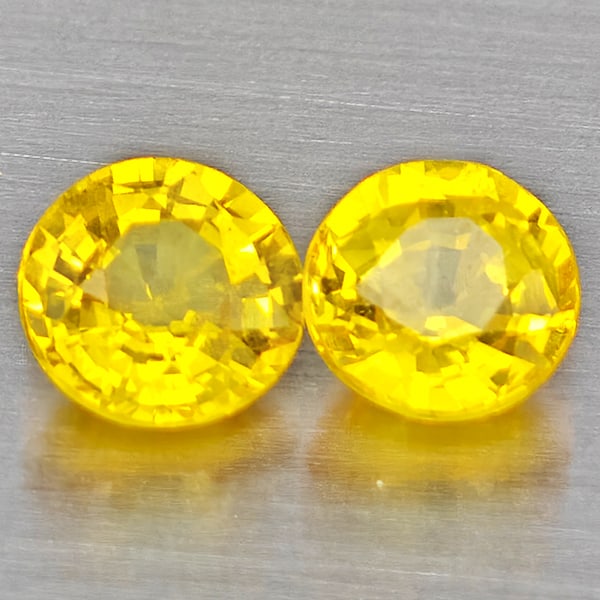 Natural Yellow Sapphire Gemstones 0.61 Ct. 2 Pcs. Round Shape 4 Mm.: Product ID: 806162757 Product Name: Natural Orange Sapphire Weight: 0.61 CT. Size: 4 x 4 x 2.3 MM. Shape: Round Shape Color: Yellow Clarity:VSI Luster: Good Gems Origin: Thailand Treatment: Heated Cry