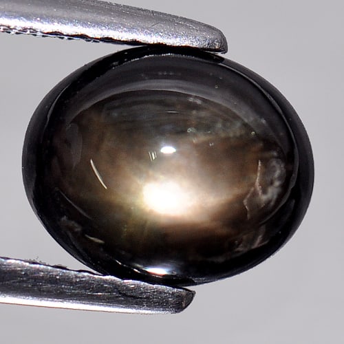Natural Black Star Sapphire Gemstones 3.51 Ct. Oval Cabochon Shape 9.4 x 7.8 Mm.: Product ID: 806132820 Product Name: Natural Star Sapphire Weight: 3.51 CT. Size: 9.4 x 7.8 x 4.1 MM. Shape: Oval Cabochon Color: Black Clarity:Opaque Luster: Good 6 Rays Star Gems Origin: Thailand Tre