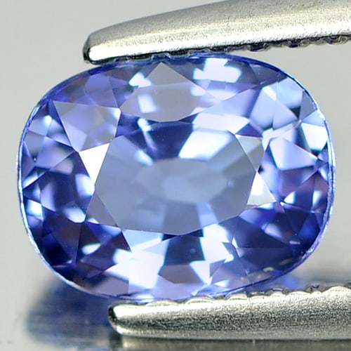 Natural Blue Tanzanite Gemstones 0.94 Ct. Clean Oval Shape 6.9 x 5.4 x 3.4 Mm.: Product ID: 807006517 Product Name: Natural Tanzanite Weight: 0.94 CT. Size: 6.9 x 5.4 x 3.4 MM. Shape: Oval Color: Violetish Blue Clarity:IF Luster: Very Good Gems Origin: Tanzania Treatment: Heated 