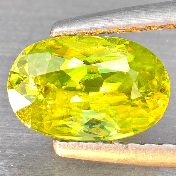 Natural Multi-Color Sphene Gemstones With Rainbow Spark 1.05 Ct. Oval Shape 8.1 x 5.2 Mm.: Product ID: 806509282 Product Name: Natural Sphene Weight: 1.05 CT. Size: 8.1 x 5.2 x 3.5 MM. Shape: Oval Color: Multi-Color Clarity:SI1 Luster: Good Gems Origin: Madagascar Treatment: Unheated Crysta