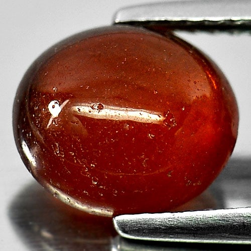 Natural Orangish Red Spessartine Garnet Gemstones 3.17 Ct. Oval Cabochon Shape 9.4 x 8.3 Mm.: Product ID: 802934712 Product Name: Natural Spessartine Weight: 3.17 CT. Size: 9.4 x 8.3 x 4.6 MM. Shape: Oval Cabochon Color: Red Clarity:Semi - Transparent Luster: Good Gems Origin: Namibia Treatmen
