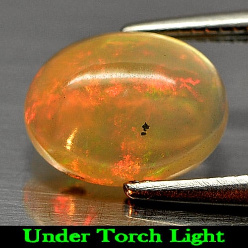 Natural Multi-Color Play Of Colour Opal Gemstones 1.12 Ct. Oval Cabochon Shape 9 x 7 Mm.: Product ID: 818722990 Product Name: Natural Opal Weight: 1.12 CT. Size: 9 x 7 x 3.7 MM. Shape: Oval Cabochon Color: Multi Color Clarity:Semi - Transparent Luster: Strong Iridescent Gems Origin: Ethiop