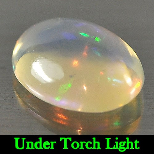 Natural Multi-Color Play Of Colour Opal Gemstones 1.19 Ct. Oval Cabochon Shape 9.2 x 7.2 Mm.: Product ID: 818723022 Product Name: Natural Opal Weight: 1.19 CT. Size: 9.2 x 7.2 x 3.8 MM. Shape: Oval Cabochon Color: Multi Color Clarity:Semi - Transparent Luster: Strong Iridescent Gems Origin: Et