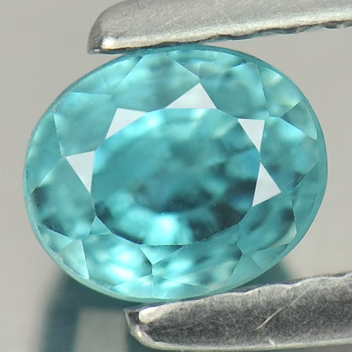 Natural Blue Zircon Gemstones 1.18 Ct. Oval Shape 5.3 x 4.5 Mm.: Product ID: 807721426 Product Name: Natural Zircon Weight: 1.18 CT. Size: 5.3 x 4.5 x 4.4 MM. Shape: Oval Color: Blue Clarity:VSI Luster: Good Gems Origin: Cambodia Treatment: Heated Crystal Structure