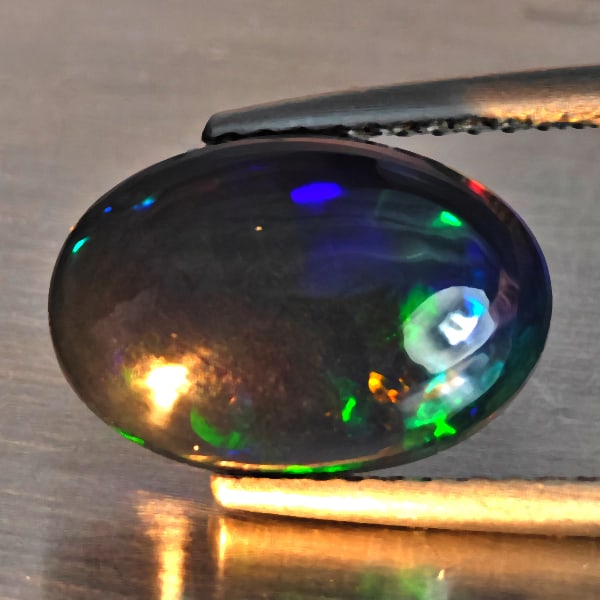 Natural Multi Color Play Of Colour Opal Gemstones 2.21 Ct. Oval Cabochon Shape 12.2 x 8.3 Mm.: Product ID: 818728591 Product Name: Natural Opal Weight: 2.21 CT. Size: 12.2 x 8.3 x 4.8 MM. Shape: Oval Cabochon Shape Color: Multi-Color Clarity:Semi - Transparent Luster: Good Gems Origin: Ethiopia