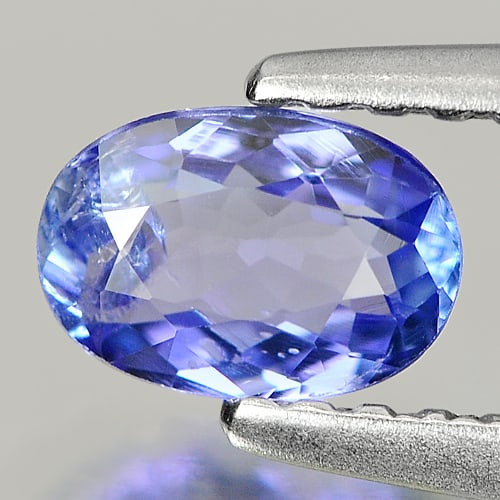 Natural Violetish Blue Tanzanite 0.45 Ct. Oval Shape 5.9 x 4.1 Mm.: Product ID: 807007319 Product Name: Natural Tanzanite Weight: 0.45 CT. Size: 5.9 x 4.1 x 2.4 MM. Shape: Oval Color: Violetish Blue Clarity:SI Luster: Good Gems Origin: Tanzania Treatment: Heated Cryst