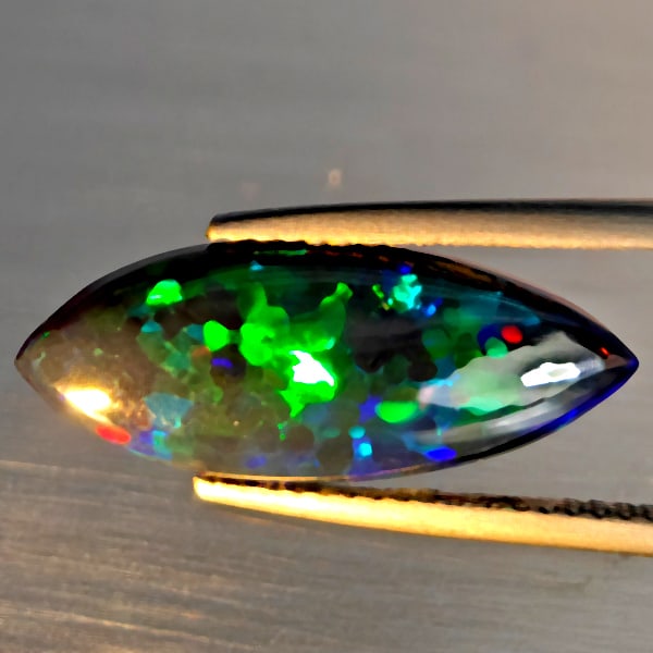 Natural Multi Color Play Of Colour Opal Gemstones 2.52 Ct. Marquise Cabochon Shape 21 x 8.1 Mm.: Product ID: 818728456 Product Name: Natural Opal Weight: 2.52 CT. Size: 21 x 8.1 x 3.7 MM. Shape: Marquise Cabochon Color: Multi-Color Clarity:Semi - Transparent Luster: Good Gems Origin: Ethiopia Tre