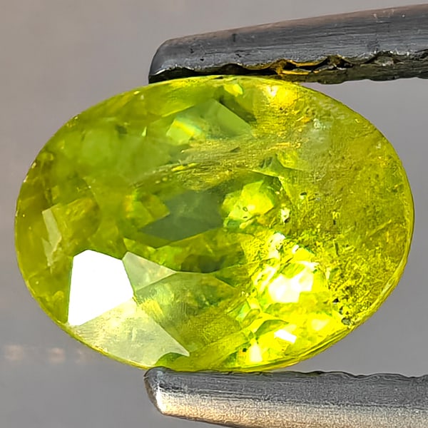 Natural Multi-Color Sphene Gemstones With Rainbow Spark 1.15 Ct. Oval Shape 7 x 5.3 Mm.: Product ID: 806509222 Product Name: Natural Sphene Weight: 1.15 CT. Size: 7 x 5.3 x 4.5 MM. Shape: Oval Shape Color: Multi-Color Clarity:SI1 Luster: Good Gems Origin: Madagascar Treatment: Unheated Cr