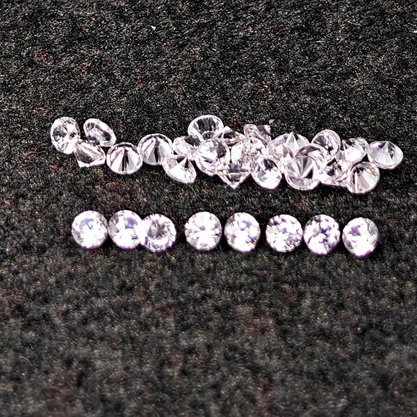 Natural White Zircon Gemstones 0.63 Ct. 30 Pcs. Round Diamond Cut 1.5 Mm.: Product ID: 807743107 Product Name: Natural Zircon Weight: 0.63 CT. Size: 1.5 x 1.5 x 1.2 MM. Shape: Round Diamond Cut Color: White Clarity:VSI Luster: Good Gems Origin: Cambodia Treatment: Heated Cry