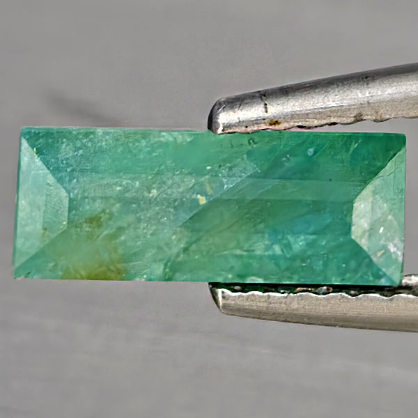 Natural Green Blueish Grandidierite Gemstones 1.73 Ct. Baguette Shape 10.2 x 4.3 Mm.: Product ID: 803100043 Product Name: Natural Magnet Weight: 1.73 CT. Size: 10.2 x 4.3 x 3.5 MM. Shape: Baguette Color: Green Blueish Clarity:SI1 Luster: Good Gems Origin: Madagascar Treatment: Unheated