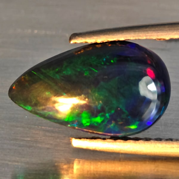 Natural Multi Color Play Of Colour Opal Gemstones 1.66 Ct. Pear Cabochon Shape 13 x 7.9 Mm.: Product ID: 818728531 Product Name: Natural Opal Weight: 1.66 CT. Size: 13 x 7.9 x 4.2 MM. Shape: Pear Cabochon Color: Multi-Color Clarity:Semi - Transparent Luster: Good Gems Origin: Ethiopia Treatme