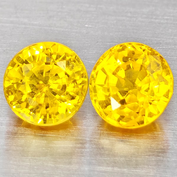 Natural Yellow Sapphire Gemstones 0.73 Ct. 2 Pcs. Round Shape 3.9 Mm.: Product ID: 806162923 Product Name: Natural Yellow Sapphire Weight: 0.73 CT. Size: 3.9 x 3.9 x 3 MM. Shape: Round Shape Color: Yellow Clarity:VSI Luster: Good Gems Origin: Thailand Treatment: Heated C