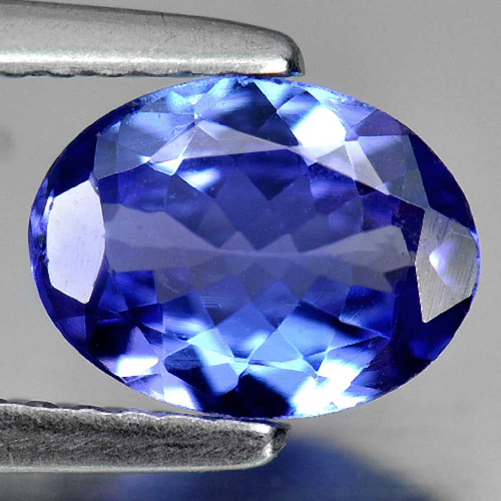 Natural Blue Tanzanite Gemstones 1.03 Ct. Oval Shape 8 x 6 Mm.: Product ID: 807009014 Product Name: Natural Tanzanite Weight: 1.03 CT. Size: 8 x 6 x 3 MM. Shape: Oval Color: Violetish Blue Clarity:VVS Luster: Very Good Gems Origin: Tanzania Treatment: Heated Cryst