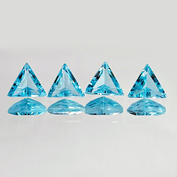 Natural Swiss Blue Topaz Gemstones 2.11 Ct. 4 Pcs. Trilliant Shape 5.6 Mm.: Product ID: 807167771 Product Name: Natural Blue Topaz Weight: 2.11 CT. Size: 5.6 x 5.6 x 3 MM. Shape: Trilliant Color: Blue Clarity:VVS Luster: Good Gems Origin: Brazil Treatment: Treated Crystal Str