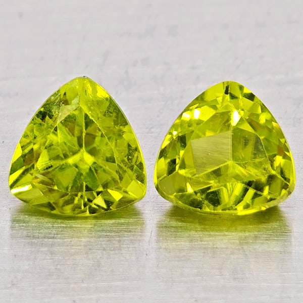Natural Green Peridot Gemstones 2.11 Ct. 2 Pcs. Trilliant Shape 6 Mm.: Product ID: 805317531 Product Name: Natural Peridot Weight: 2.11 CT. Size: 6 x 6 x 4.5 MM. Shape: Trilliant Color: Green Clarity:SI1 Luster: Good Gems Origin: Pakistan Treatment: Unheated Crystal Stru