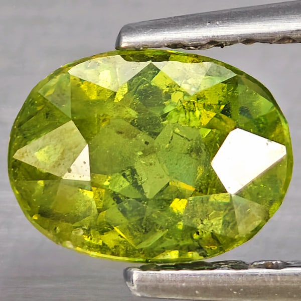 Natural Multi Color Green Demantoid Garnet Gemstones 0.86 Ct. Oval Shape 6.8 x 5.1 Mm.: Product ID: 802937413 Product Name: Natural Demantoid Weight: 0.86 CT. Size: 6.8 x 5.1 x 4 MM. Shape: Oval Shape Color: Multi-Color Green Clarity:SI1 Luster: Good Gems Origin: Madagascar Treatment: Un