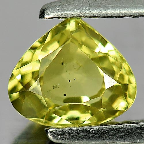 Natural Greenish Yellow Chrysoberyl Gemstone 1.16 Ct. Pear Shape 6.9 x 6 Mm.: Product ID: 801701119 Product Name: Natural Chrysoberyl Weight: 1.16 CT. Size: 6.9 x 6 x 3.6 MM. Shape: Pear Color: Yellow Clarity:VSI Luster: Good Gems Origin: Madagascar Treatment: Unheated Crystal 