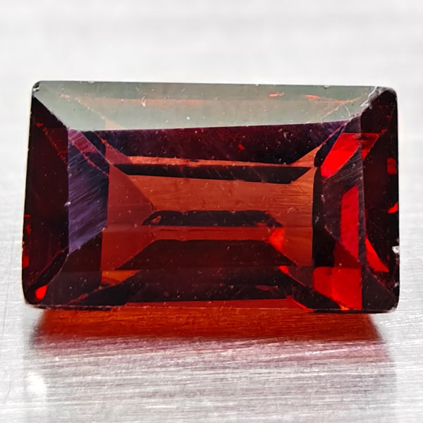 Natural Orange Red Spessartine Garnet Gemstones 1.63 Ct. Baguette Shape 7.6 x 4.6 Mm.: Product ID: 102903898 Product Name: Natural Spessartine Weight: 1.63 CT. Size: 7.6 x 4.6 x 4.2 MM. Shape: Baguette Color: Orange Red Clarity:VVS Luster: Good Gems Origin: Nigeria Treatment: Unheated C