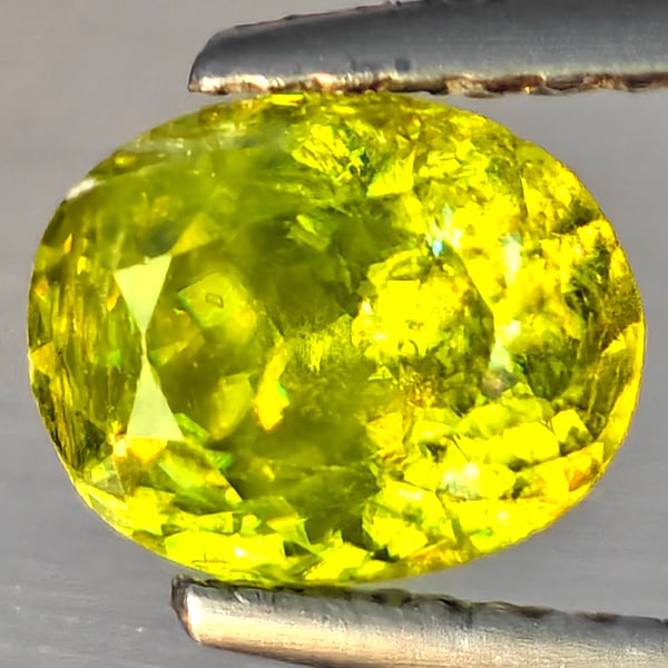 Natural Multi-Color Sphene Gemstones With Rainbow Spark 1.44 Ct. Oval Shape 7.1 x 6 Mm.: Product ID: 806509215 Product Name: Natural Sphene Weight: 1.44 CT. Size: 7.1 x 6 x 4.6 MM. Shape: Oval Shape Color: Multi-Color Clarity:SI1 Luster: Good Gems Origin: Madagascar Treatment: Unheated Cr
