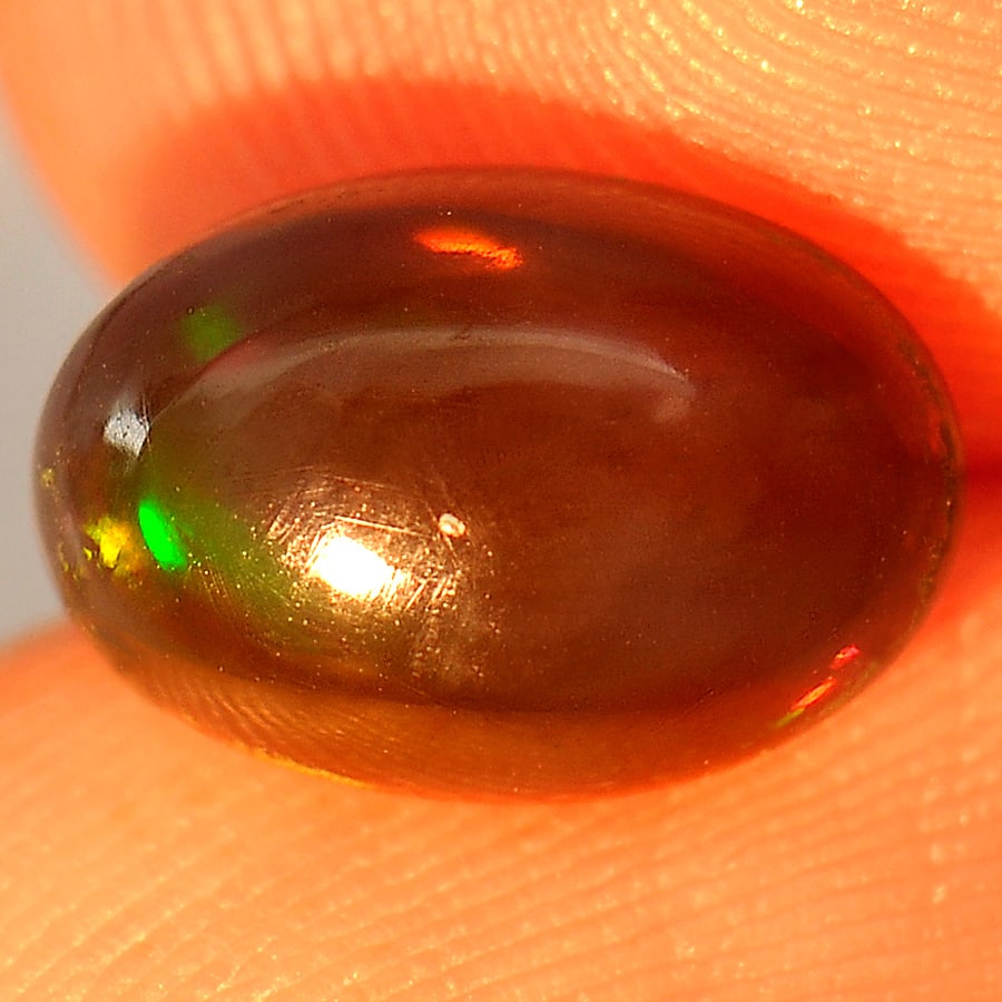 Natural Play Of Color Rainbow Fire Red Black Opal Gemstones 1.36 Ct. Oval Cabochon Shape 10.3 x 7: Product ID: 818724566 Product Name: Natural Opal Weight: 1.36 CT. Size: 10.3 x 7 x 4.1 MM. Shape: Oval Cabochon Color: Multi-Color Clarity:Opaque Luster: Iridescent Gems Origin: Ethiopia Treatment: En