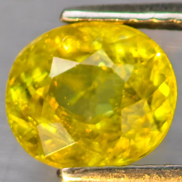 Natural Multi Color Titanium Rainbow Spark Sphene Gemstones 1.87 Ct. Oval Shape 7.6 x 6.7 Mm.: Product ID: 806509075 Product Name: Natural Sphene Weight: 1.87 CT. Size: 7.6 x 6.7 x 4.5 MM. Shape: Oval Color: Multi-Color Clarity:SI1 Luster: Good Gems Origin: Madagascar Treatment: Unheated Crysta