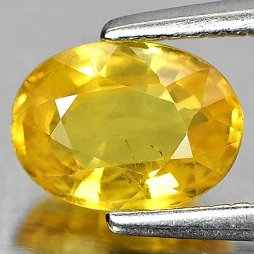 Natural Yellow Sapphire Gemstones 1.10 Ct. Oval Shape 7 x 5.2 Mm.: Product ID: 806150937 Product Name: Natural Yellow Sapphire Weight: 1.10 CT. Size: 7 x 5.2 x 3.2 MM. Shape: Oval Color: Yellow Clarity:SI Luster: Good Gems Origin: Thailand Treatment: Heated Crystal S