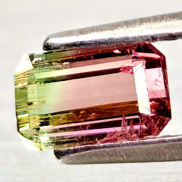 Natural Bi Color Tourmaline Gemstones 0.75 Ct. Octagon Shape 6.2 x 4 Mm.: Product ID: 807250922 Product Name: Natural Tourmaline Weight: 0.75 CT. Size: 6.2 x 4 x 3.3 MM. Shape: Octagon Color: Bi Color Clarity:VSI - SI1 Luster: Good Gems Origin: Nigeria Treatment: Unheated C