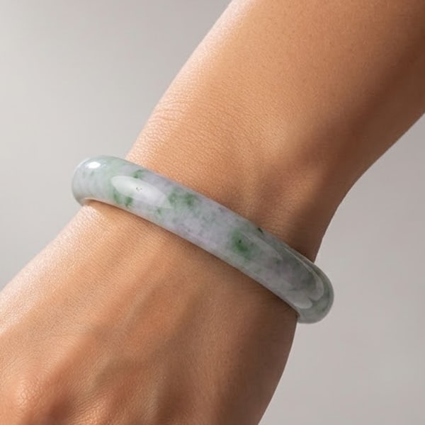 Natural Green Jade Gemstones Bangle 363.19 Ct. Diameter 59 Mm.: Product ID: 819813510 Product Name: Natural Jade Weight: 363.19 CT. Size: 74 x 59 x 15 MM. Shape: Round Color: Multi-Color Clarity:Opaque Luster: Good Gems Origin: Thailand Treatment: Unheated Crystal