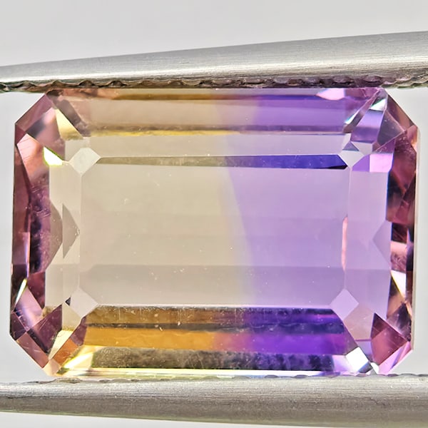 Natural Bi Color Ametrine Gemstones 4.35 Ct. Octagon Shape 11.5 x 8.4 Mm.: Product ID: 800408611 Product Name: Natural Ametrine Weight: 4.35 CT. Size: 11.5 x 8.4 x 5.6 MM. Shape: Octagon Color: Bi Color Clarity:VVS Luster: Good Gems Origin: Bolivia Treatment: Unheated Crysta