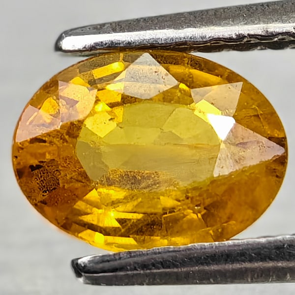 Natural Yellow Sapphire Gemstones 1.02 Ct. Oval Shape 7 x 5.2 Mm.: Product ID: 806162569 Product Name: Natural Yellow Sapphire Weight: 1.02 CT. Size: 7 x 5.2 x 3.1 MM. Shape: Oval Color: Yellow Clarity:VSI - SI1 Luster: Good Gems Origin: Thailand Treatment: Heated Cr