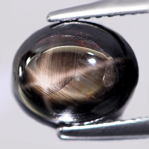Natural Black Star Sapphire Gemstones 6 Rays 3.77 Ct. Oval Caboshon Shape 9.2 x 7.5 Mm.: Product ID: 806137530 Product Name: Natural Star Sapphire Weight: 3.77 CT. Size: 9.2 x 7.5 x 4.8 MM. Shape: Oval Cabochon Color: Black Clarity:Opaque Luster: Good 6 Rays Star Gems Origin: Thailand Tre