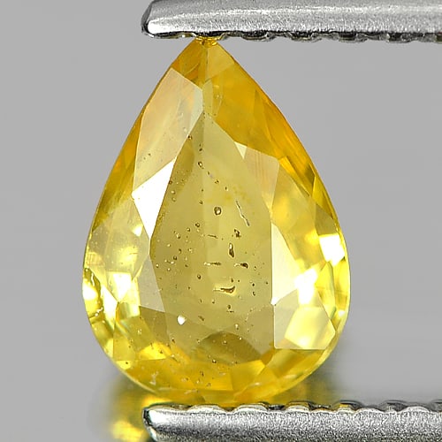 Natural Yellow Sapphire Gemstones 0.59 Ct. Pear Shape 6.8 x 4.9 Mm.: Product ID: 806140199 Product Name: Natural Yellow Sapphire Weight: 0.59 CT. Size: 6.8 x 4.9 x 2.3 MM. Shape: Pear Color: Yellow Clarity:SI Luster: Good Gems Origin: Thailand Treatment: Heated Crystal