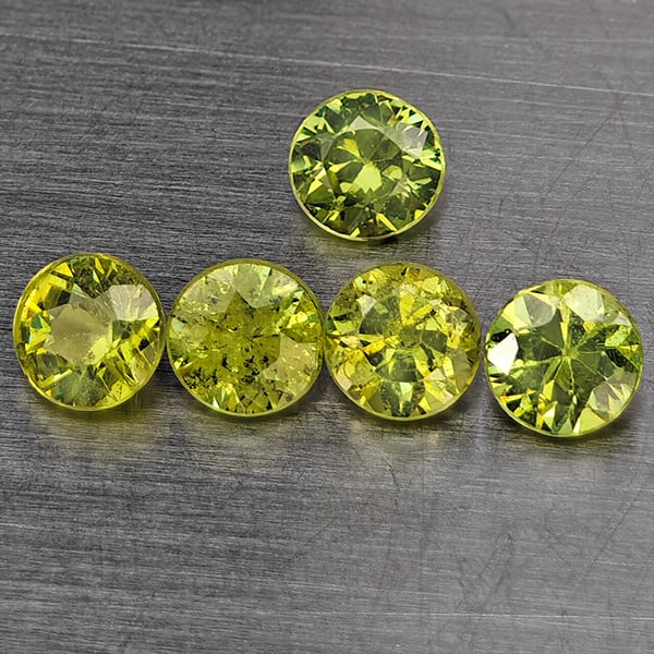 Natural Green Demantiod Garnet Gemstones 1.59 Ct. 10 Pcs. Round Diamond Cut 3.2 Mm.: Product ID: 802937647 Product Name: Natural Demantoid Weight: 1.59 CT. Size: 3.2 x 3.2 x 2.4 MM. Shape: Round Diamond Cut Color: Green Clarity:SI1 Luster: Good Gems Origin: Madagascar Treatment: Unhea