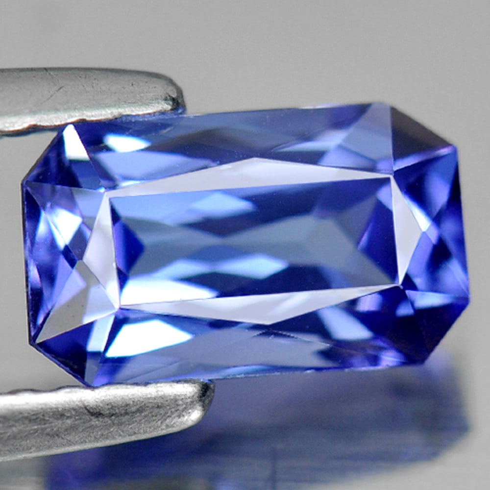 Natural Blue Tanzanite Gemstones 1.27 Ct. Clean Octagon Shape 8 x 4.8 Mm.: Product ID: 807006243 Product Name: Natural Tanzanite Weight: 1.27 CT. Size: 8 x 4.8 x 3.8 MM. Shape: Octagon Color: Violetish Blue Clarity:IF Luster: Good Gems Origin: Tanzania Treatment: Heated Crys
