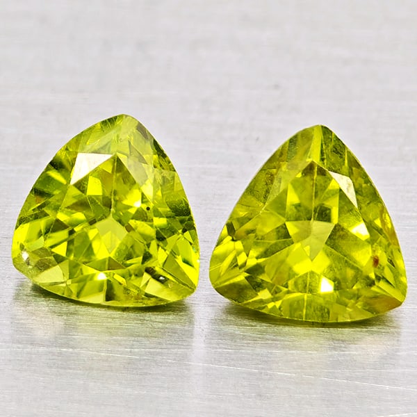 Natural Green Peridot Gemstones 1.78 Ct. 2 Pcs Trilliant Shape 6 Mm.: Product ID: 805317565 Product Name: Natural Peridot Weight: 1.78 CT. Size: 6 x 6 x 4.1 MM. Shape: Trilliant Color: Green Clarity:SI1 Luster: Good Gems Origin: Pakistan Treatment: Unheated Crystal Stru