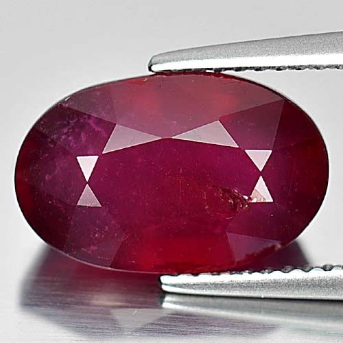 Natural Purplish Red Ruby Gemstones 7.17 Ct. Oval Shape 13.2 x 8.4 Mm.: Product ID: 805927627 Product Name: Natural Ruby Weight: 7.17 CT. Size: 13.2 x 8.4 x 6.5 MM. Shape: Oval Color: Purplish Red Clarity:VSI Luster: Good Gems Origin: Madagascar Treatment: Heated (Lead-gl