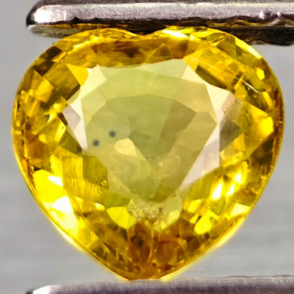 Natural Yellow Songea Sapphire Gemstones 0.69 Ct. Heart Shape 5.3 x 5.3 Mm.: Product ID: 106114209 Product Name: Natural Yellow Sapphire Weight: 0.69 CT. Size: 5.3 x 5.3 x 2.6 MM. Shape: Heart Color: Yellow Clarity:VSI Luster: Very Good Gems Origin: Tanzania Treatment: Heated 