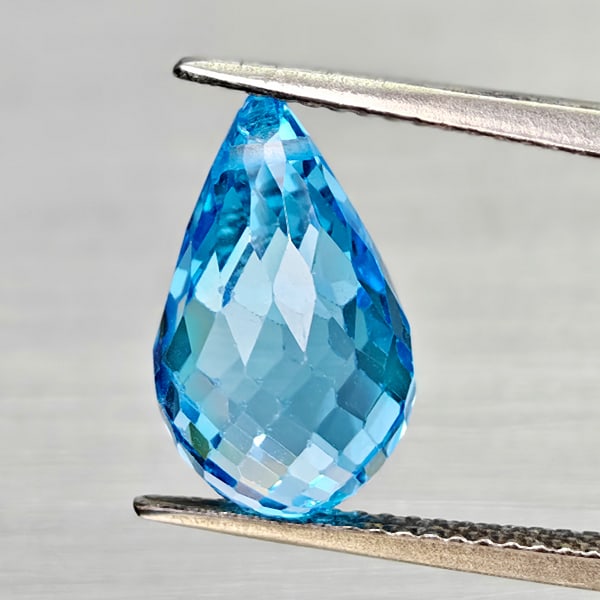 Natural Swiss Blue Topaz Gemstones 6.59 Ct. Briolette with Drilled Cut 13.4 x 7.8 Mm.: Product ID: 807168049 Product Name: Natural Blue Topaz Weight: 6.59 CT. Size: 13.4 x 7.8 x 7.8 MM. Shape: Briolette With Drilled Color: Swiss Blue Clarity:VSI - SI1 Luster: Good Gems Origin: Brazil Tr