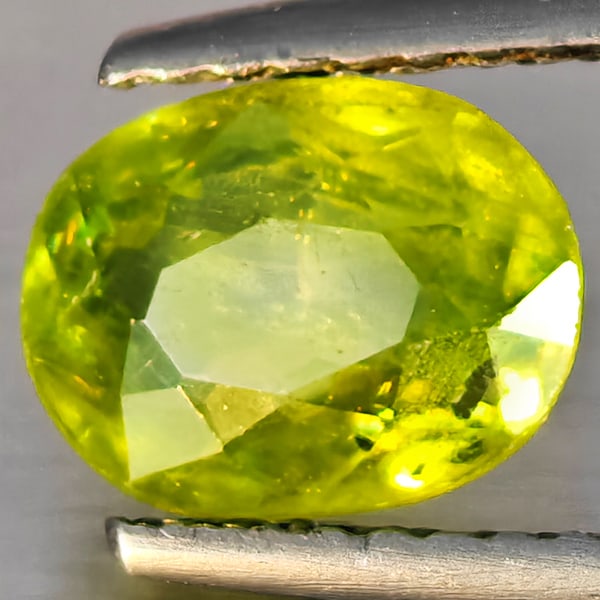 Natural Multi-Color Sphene Gemstones With Rainbow Spark 1.46 Ct. Oval Shape 8 x 6.1 Mm.: Product ID: 806509228 Product Name: Natural Sphene Weight: 1.46 CT. Size: 8 x 6.1 x 3.6 MM. Shape: Oval Shape Color: Multi-Color Clarity:SI1 Luster: Adamantine Gems Origin: Madagascar Treatment: Unhea