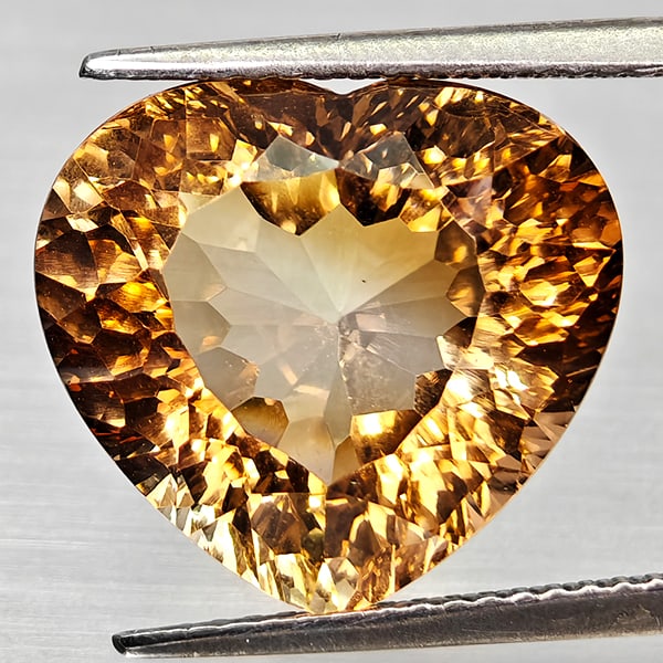 Natural Imperial Topaz Gemstones 12.91 Ct. Heart Concave Cut 15 x 13.7 Mm.: Product ID: 807168301 Product Name: Natural Topaz Weight: 12.91 CT. Size: 15 x 13.7 x 9 MM. Shape: Heart Concave Color: Imperial Clarity:VSI Luster: Good Gems Origin: Brazil Treatment: Treated Crystal