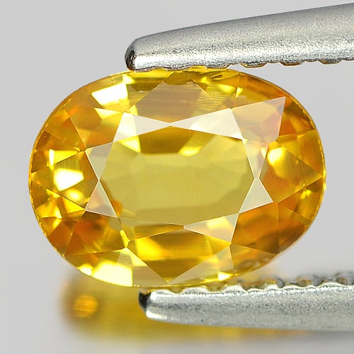 Natural Yellow Sapphire Gemstones 0.94 Ct. Oval Shape 6.7 x 5 Mm.: Product ID: 806151846 Product Name: Natural Yellow Sapphire Weight: 0.94 CT. Size: 6.7 x 5 x 3 MM. Shape: Oval Color: Yellow Clarity:VVS Luster: Very Good Gems Origin: Thailand Treatment: Heated Cryst