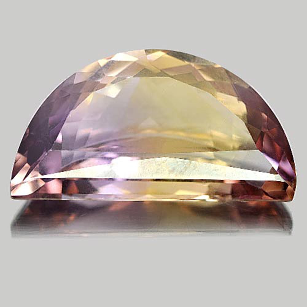 Natural Bi Color Ametrine Gemstones 10.19 Ct. Fancy Shape 20.8 x 11.3 Mm.: Product ID: 800407188 Product Name: Natural Ametrine Weight: 10.19 CT. Size: 20.8 x 11.3 x 6.8 MM. Shape: Fancy Color: Bi-Color Clarity:VVS Luster: Very Good Gems Origin: Bolivia Treatment: Unheated C