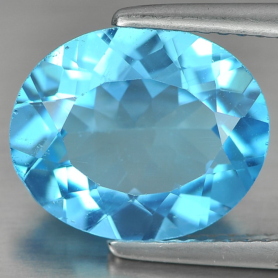 Natural Swiss Blue Topaz Gemstones 4.59 Ct. Oval Shape 12 x 10 Mm.: Product ID: 807161188 Product Name: Natural Blue Topaz Weight: 4.59 CT. Size: 12 x 10 x 5.2 MM. Shape: Oval Color: Swiss Blue Clarity:VSI Luster: Good Gems Origin: Brazil Treatment: Treated Crystal St