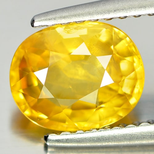 Natural Yellow Sapphire Gemstones 1.85 Ct. Oval Shape 8 x 6.5 Mm.: Product ID: 806151575 Product Name: Natural Yellow Sapphire Weight: 1.85 CT. Size: 8 x 6.5 x 3.9 MM. Shape: Oval Color: Yellow Clarity:SI2 Luster: Good Gems Origin: Thailand Treatment: Heated Crystal 