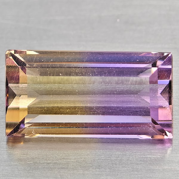 Natural Bi Color Ametrine Gemstones 1.95 Ct. Baguette Shape 11.3 x 5.3 Mm.: Product ID: 800408514 Product Name: Natural Ametrine Weight: 1.95 CT. Size: 10.3 x 5.3 x 4.3 MM. Shape: Baguette Color: Bi Color Clarity:VSI Luster: Good Gems Origin: Bolivia Treatment: Unheated Cryst