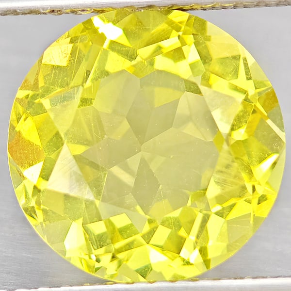 Natural Yellow Lemon Quartz Gemstones 4.67 Ct. Round Shape 11.1 Mm.: Product ID: 805530182 Product Name: Natural Quartz Weight: 4.67 CT. Size: 11.1 x 11.1 x 6.8 MM. Shape: Round Shape Color: Yellow Lemon Clarity:VSI Luster: Good Gems Origin: Brazil Treatment: Unheated 