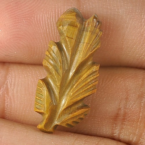 Natural Golden Tiger Eye Gemstones 6.80 Ct. Carving Leaves Shape 21 x 9.7 Mm.: Product ID: 811600039 Product Name: Natural Tiger eye Weight: 6.80 CT. Size: 21 x 9.7 x 4.7 MM. Shape: Carving Leaves Color: Golden Clarity:Opaque Luster: Good Gems Origin: Thailand Treatment: Unheate