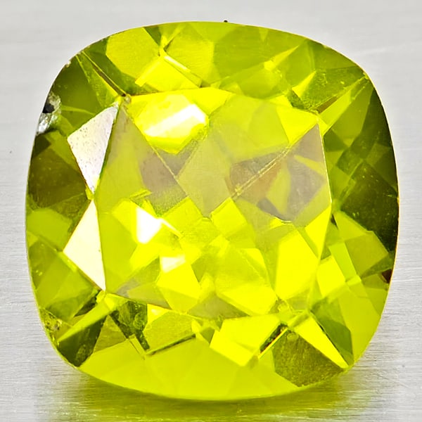 Natural Green Peridot Gemstones 1.57 Ct. Cushion Shape 7.1 Mm.: Product ID: 805317251 Product Name: Natural Peridot Weight: 1.57 CT. Size: 7.1 x 7.1 x 4.5 MM. Shape: Cushion Shape Color: Green Clarity:VSI - SI1 Luster: Good Gems Origin: Pakistan Treatment: Unheate