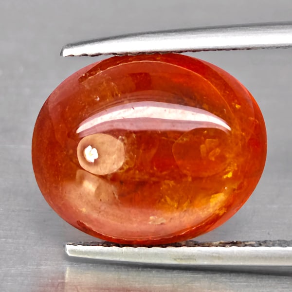 Natural Orangish Red Spessartine Garnet Gemstones 13.14 Ct. Oval Cabochon Shape: Product ID: 802938028 Product Name: Natural Garnet Weight: 13.14 CT. Size: 14.4 x 12 x 7.4 MM. Shape: Oval Cabochon Color: Orangish Red Clarity:SI1 Luster: Good Gems Origin: Namibia Treatment: Unheate