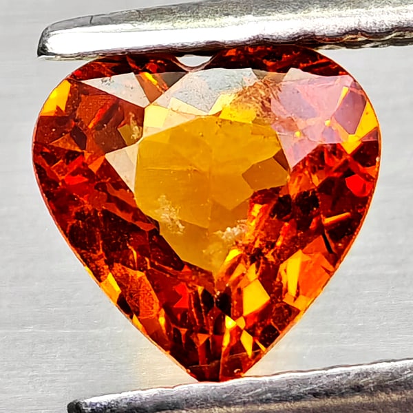 Natural Orangish Red Spessartine Garnet Gemstones 0.92 Ct. Heart Shape 6.2 x 6.2 Mm.: Product ID: 802936815 Product Name: Natural Spessartine Weight: 0.92 CT. Size: 6.2 x 6.2 x 2.9 MM. Shape: Heart Shape Color: Orangish Red Clarity:VSI Luster: Good Gems Origin: Namibia,Africa Treatment